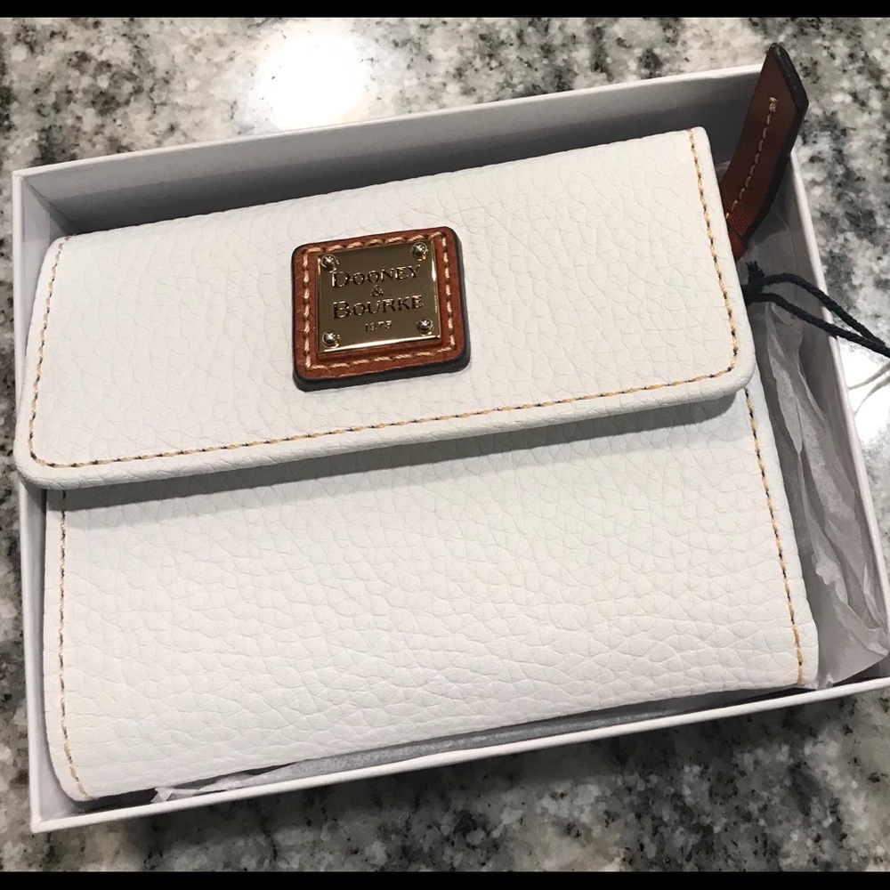Dooney & Burk white wallet
Outside zip pocket.